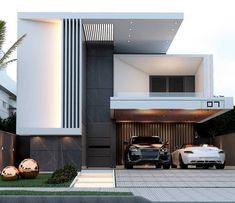 two cars parked in front of a modern house