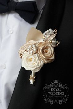 a man in a tuxedo wearing a boutonniere with flowers on it