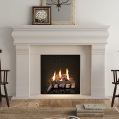 a fire place in a living room with chairs