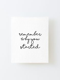 a handwritten quote on a white card