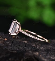 "This is a 1.5 carat natural moonstone engagement ring in solid gold,about 6x8mm emerald cut. The accent stones are natural real diamonds,SI-H quality. It can be made in any ring size. However please contact me to custom make it to a special big or small size. It can be made in white gold,rose gold or yellow gold with 14k or 18k. However for some people who are nickel allergic,I can also make it to 925 sterling silver to make you can wear it. The ring is handmade,very high quality! 30 days money Elegant Emerald Cut Moonstone Ring For Anniversary, Dainty Emerald Cut Diamond Ring In Rose Gold, Dainty Emerald-cut Rose Gold Diamond Ring, Dainty Emerald Cut Ring With Prong Setting, Emerald Cut Half Eternity Jewelry For Promise, Dainty Emerald Cut Rose Gold Diamond Ring, Dainty Emerald Cut Rose Gold Rings, Dainty Rose Gold Emerald-cut Diamond Ring, White Emerald Cut Half Eternity Jewelry