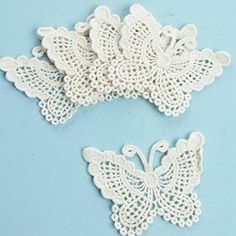 two pieces of white lace on a blue background