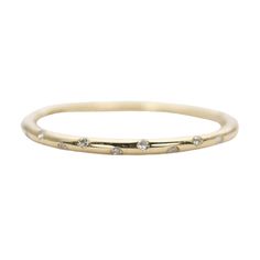 Aurora Designer - Diamond "Sprinkle" 14K Gold Wedding Band Stacking Ring Flush Set 10 Diamonds AD1147
♥  Solid 14K gold ring flush set with 10 diamonds, sprinkled evenly across the center of the ring  ♥  This is a simplistic design with half round band.  ♥  US Size 3-9  ♥  Band width: 1.3-1.5mm  ♥  Gemstone weight: 10 Everyday Eternity Band With Diamond Accents, Minimalist Eternity Band With Single Cut Diamonds, Diamond Stackable Rings With Smooth Bezel, Everyday Diamond Ring With Smooth Bezel, 14k Gold Wedding Band, Simplistic Design, 14k Gold Ring, Gold Wedding Band, Stacking Ring