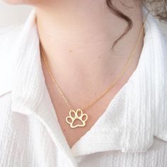 Engraved Paw Print Necklace After the success of our best-selling minimalist paw print necklace, we've introduced this elegant, slightly larger paw print design for those who prefer a more visible and stylish statement. Perfect for pet lovers looking for a standout piece in their jewelry collection. View our original best-selling paw print necklace here:  https://www.etsy.com/listing/1671388056/engraved-paw-print-necklace-custom-gold?ref=shop_review ►HOW TO ORDER 1- Select your preferred color a Elegant Paw Print Necklace For Gift, Christmas Gift For Dog, Pet Keepsake, Stamped Necklaces, Paw Print Necklace, Paw Print Design, Dog Christmas Gifts, Gift For Dog, Designer Gifts