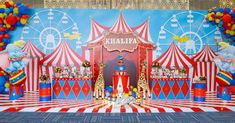 circus themed stage set up for children's birthday party with balloons and clowns