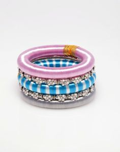 three bracelets are stacked on top of each other