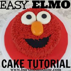 an easy elmo cake with red frosting and eyes