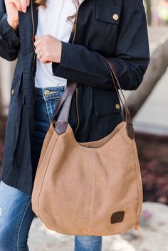 our anniston hobo bag is as cute as it is functional. the slouchy look pairs perfectly with some amazing qualities to help you store and easily access all of your daily essentials. it comes with two magnetic-snap compartments on top on each side of the main zipper-enclosed compartment. this makes it a breeze to throw i Beige Hobo Bag With Zipper For On-the-go, Casual Hobo Bag With Cell Phone Pocket For On-the-go, Casual Everyday Hobo Bag, Everyday Crossbody Hobo Bag With Zipper, On-the-go Hobo Bag With Zipper Pocket, Everyday Crossbody Hobo Bag With Zipper Closure, Everyday Use Crossbody Hobo Bag With Zipper Closure, Casual Everyday Hobo Bucket Bag, Everyday Hobo Tote Bag With Zipper Pocket