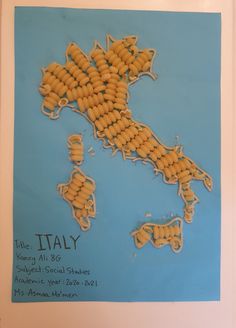 a map made out of macaroni and cheese with the name italy on it