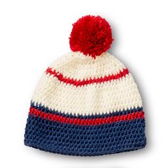 a crocheted hat with a red, white and blue pom - pom