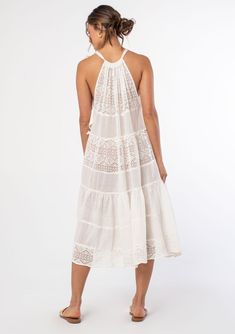 An elegant bohemian swim cover-up dress. Designed in sheer cotton gauze with mixed lace panels. Swim cover-up Mixed media Relaxed, flowy fit Sleeveless Mid-length Tiered body Drawstring halter neckline Tie shoulder Sheer Bohemian cotton midi dress Elevate your beach wardrobe with this ultra-pretty swim cover-up. A dreamy midi dress style featuring an adjustable drawstring halter neckline, a flattering flowy sheer silhouette, and a tiered body for extra shape and movement. Model is 5'9, wearing a Sheer Spaghetti Strap Dress For Vacation, Lace Sundress With Spaghetti Straps For Beach, Summer Beach Dress With Lace Patchwork, Summer Dress With Lace Trim For Beach, Flowy Lace Trim Dress For Vacation, Flowy Lace Patchwork Beach Dresses, Airy Summer Maxi Dress For Vacation, Airy Maxi Dress For Summer Vacation, Airy Flowy Dress For Beach Cover-up