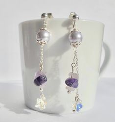 Earrings made of sterling silver. They are decorated with a Swarovski Pearl Lavender color with a tiny Swarovski Crystal and Amethyst chips hanging from a very fine sterling silver chain. Total length: 5.7 cm Materials used: -Swarovski pearls Lavender -8 mm Swarovski Crystal star -Amethyst -Silver Crystal Stars, Lavender Color, Swarovski Pearls, Sterling Silver Chains, Swarovski Crystals, Favorite Jewelry, Amethyst, Jewelry Earrings, Etsy Accessories