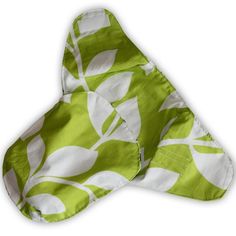 a green and white leaf print cloth on a white background with the fabric folded over it