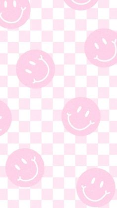 pink smiley faces on a checkered background