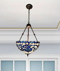 a chandelier hanging from the ceiling in a room