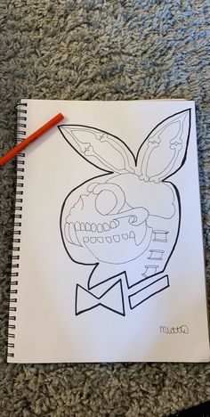 a coloring book with an apple on the cover and a pencil next to it,