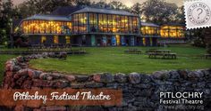 an image of a building that is lit up at night with the words pitlochry festival theatre on it