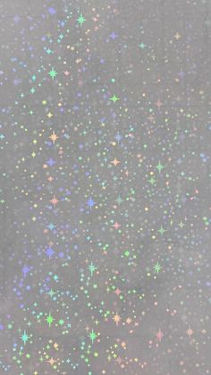 multicolored stars are scattered on a gray background in this image, there is no image here to provide a caption for