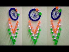 three pictures of an orange, green and white wall hanging with paper flowers on it