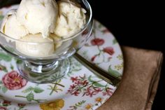 two scoops of ice cream in a glass bowl