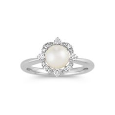 a white pearl and diamond ring