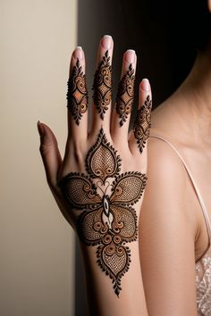 a woman with henna on her hand