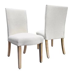 two white chairs sitting side by side next to each other