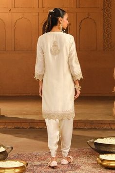 Ivory kurta featuring round neckline, three quarter sleeves, and placement Kashmiri tilla and Parsi Gara embroidery. Paired with a satin silk dhoti pant with scallop trimmed cuffs., Fit: Relaxed Semi-stitched Straight Kurta Pant Set With Dabka Work, Fitted Cream Kurta With Dabka Detailing, Traditional Drape Cream Kurta With Pearl Embroidery, Semi-stitched Cream Kurta With Gota Work, Semi-stitched Beige Kurta With Sheer Dupatta, Kurta Patterns, Dhoti Pants, Kareena Kapoor Khan, Madhuri Dixit