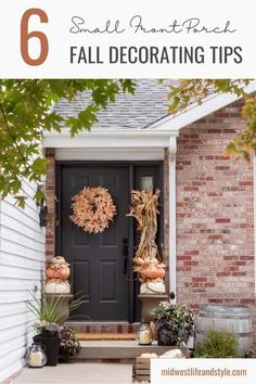 a black front door with fall decorations and pumpkins