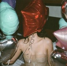 a woman with many balloons on her head