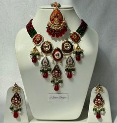 Meena kundan thappa set with matching earrings and tikka with drop bead details  Available in two colours  Deep red Soft pink  Measurements:  Earrings: 8cm drop, 3cm width Tikka : 16cm drop, 4cm width All our products are neatly wrapped  Perfect as a gift Every item is sanitised and bubble wrapped before dispatch  For hygiene purposes our jewellery is non- refundable  Please note- all our images are raw, colour may differ slightly due to lighting  All measurements are approximate Red Kundan Temple Necklace With Stone Work, Red Chandbali Jewelry Sets For Diwali, Red Kundan Temple Necklace For Diwali, Red Kundan Temple Necklace For Festivals, Red Meenakari Temple Jewelry Sets, Red Chandbali Kundan Necklace In Temple Jewelry Style, Red Kundan Jewelry Set Gift, Red Kundan Sets For Gift, Red Chandbali Temple Necklace For Festive Occasions