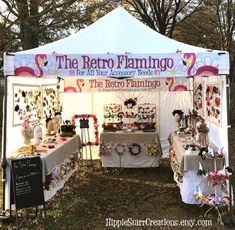 the retro flamingo tent is set up for an outdoor event