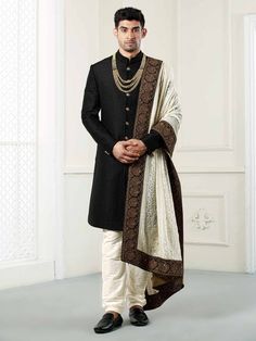 Featuring a Black quilted indowestern sherwani complemented with the georgette luckhnavi work shawl/dupatta with all over hand work on border.This is a designer piece that comes in process directly from our design house.Suitable for Indian Weddings, Bollywood parties and Indian Ceremonies, Perfect for Groom or Groomsmen.An ideal option to keep your persona composed & dignified for the wedding,sangeet event or a reception.Perfect for Groom or Groomsmen,family & friendsCOST INCLUDES SHERWA Sherwani For Men Wedding Royals, Sherwani For Men Wedding Indian Groom, Mens Wedding Wear Indian, Indowestern Sherwani, Sherwani For Men Wedding, Wedding Kurta For Men, Mens Wear Wedding, Groom Dress Men, Indian Groom Wear