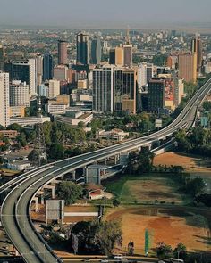 an aerial view of a highway and cityscape