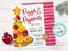 a pizza and christmas tree themed birthday party card with ornaments on the table next to it