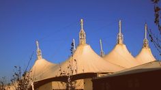 several large white domes sitting on top of a building