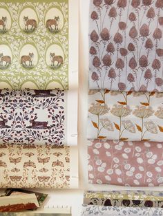 four different types of fabric with animals and flowers on them, all in various colors