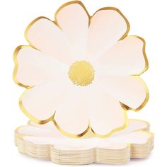 a white and gold plate with a large flower on the center, surrounded by smaller plates