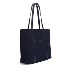 This tote is large enough for the commute to the office with enough pockets to keep your protein bars separate from your pens. Outlet Exclusive Microfiber is lightweight, solid-colored polyester Exterior features a slip pocket and a zip pocket Interior features six slip pockets Zip closure. Dimensions: 20. 0" w x 14. 75" h x 6. 5" d Handle/Strap Strap drop 12. 0" Trim Material : Faux Leather Vera Bradley Outlet Trimmed Vera Tote Bag in Classic Navy, Size: Large | Polyester Vera Bradley Tote Bags, Fashion Umbrella, Work Backpack, Weekend Travel Bags, Vera Bradley Tote, Belt Purse, Flip Flop Slippers, Toiletry Bag Travel, Mini Purse