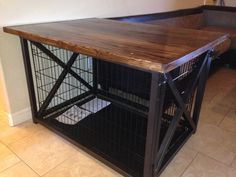 a wooden table with metal cage on top