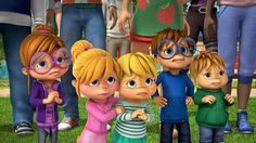 a group of cartoon characters standing in front of each other on the grass with people behind them