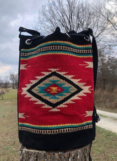 Red and Black woven southwestern bucket bag Artisan Bucket Bag With Adjustable Strap For Travel, Artisan Travel Bucket Bag With Adjustable Strap, Southwestern Multicolor Bags For Everyday Use, Multicolor Southwestern Bags For Everyday Use, Southwestern Multicolor Everyday Bags, Southwestern Style Tote Bag For Everyday Use, Multicolor Southwestern Style Everyday Bags, Multicolor Southwestern Everyday Bags, Southwestern Style Everyday Tote Bag