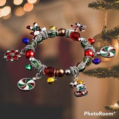 Christmas Stretch Charm Bracelet Brand New. Very Colorful With Charms Of Candy, A Stocking, & Poinsettias. Also Has Bells And Different Kinds Of Beads And Silver Spacers. Very Detailed Bracelet. Sized For Adults. I Included A Pic About The Company. There's Also A Pic Of Materials & Weight In The Next To Last Pic. Essential Oil Diffuser Bracelet, Open Cuff Bracelet, Bow Bracelet, Turquoise Cross, Pandora Style, Diffuser Bracelets, Amethyst Bracelet, Hinged Bangle, Pandora Bracelet