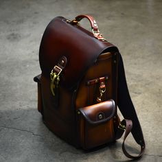 Heirloom Backpack - Patina Brown Everyday Backpack With Palladium Hardware, Leather Backpack With Palladium Hardware For Everyday Use, Classic Backpack With Adjustable Strap For Everyday, Luxury Leather Backpack For Everyday Carry, Luxury Leather Everyday Backpack, Classic Backpack For Everyday Carry, Luxury Leather-backed Satchel Backpack, Luxury Handmade Brown Leather Backpack, Luxury Vintage Leather Backpack With Waxed Finish