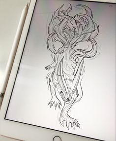 an ipad with a drawing of a dragon on the screen