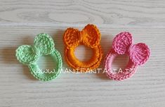 three crocheted hair ties in different colors