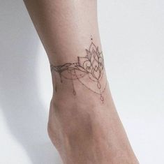 a woman's foot with a small tattoo on the side of her left leg