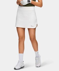 White Flex Skort – Macade Golf Athleisure Cotton Tennis Skirt For Sports, Sporty Cotton Tennis Skirt For Sports, Cotton Athleisure Skort In Short Length, Stretch Cotton Tennis Bottoms, Sporty Cotton Tennis Bottoms, Cotton Stretch Bottoms For Tennis, Sporty Short Cotton Tennis Skirt, Sporty Short Skort With Side Pockets, White Cotton Tennis Bottoms