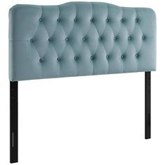 a blue headboard with black legs and buttons