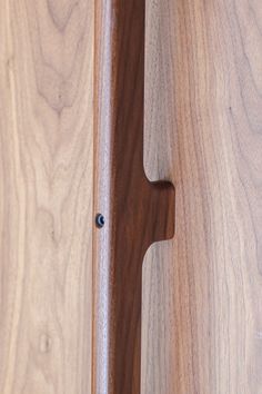 a close up of a wooden door handle